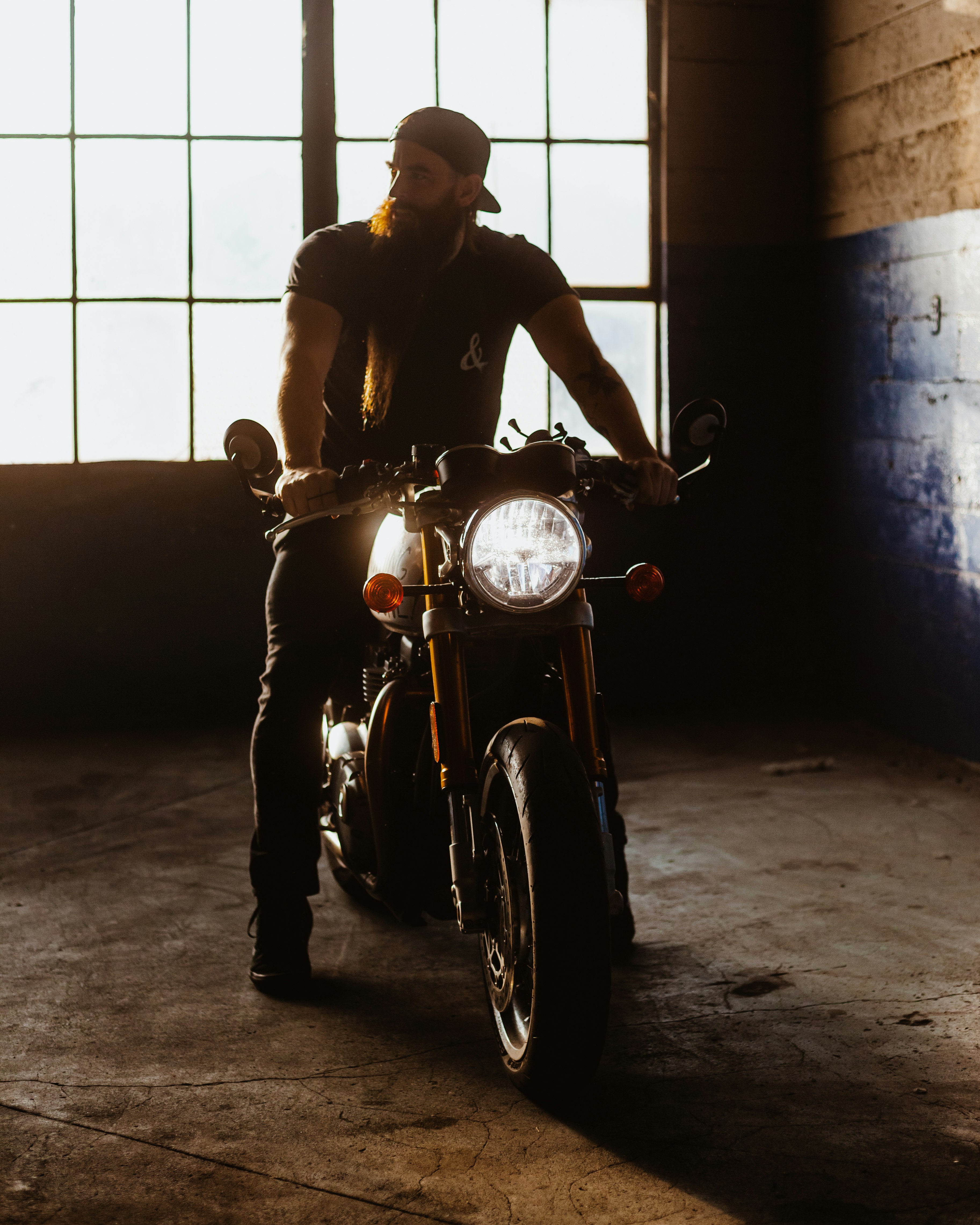 man in black jacket riding on black motorcycle